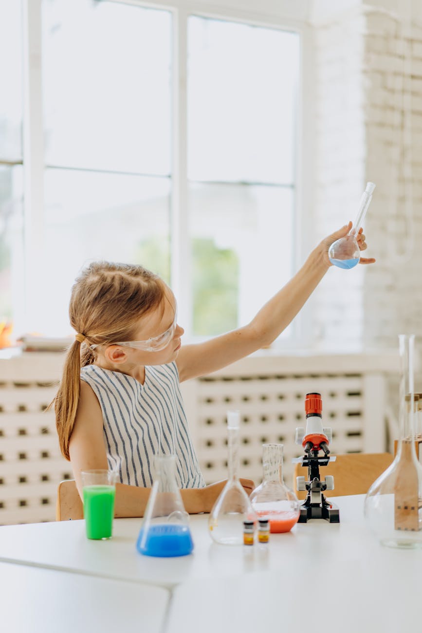 a girl holding a flask